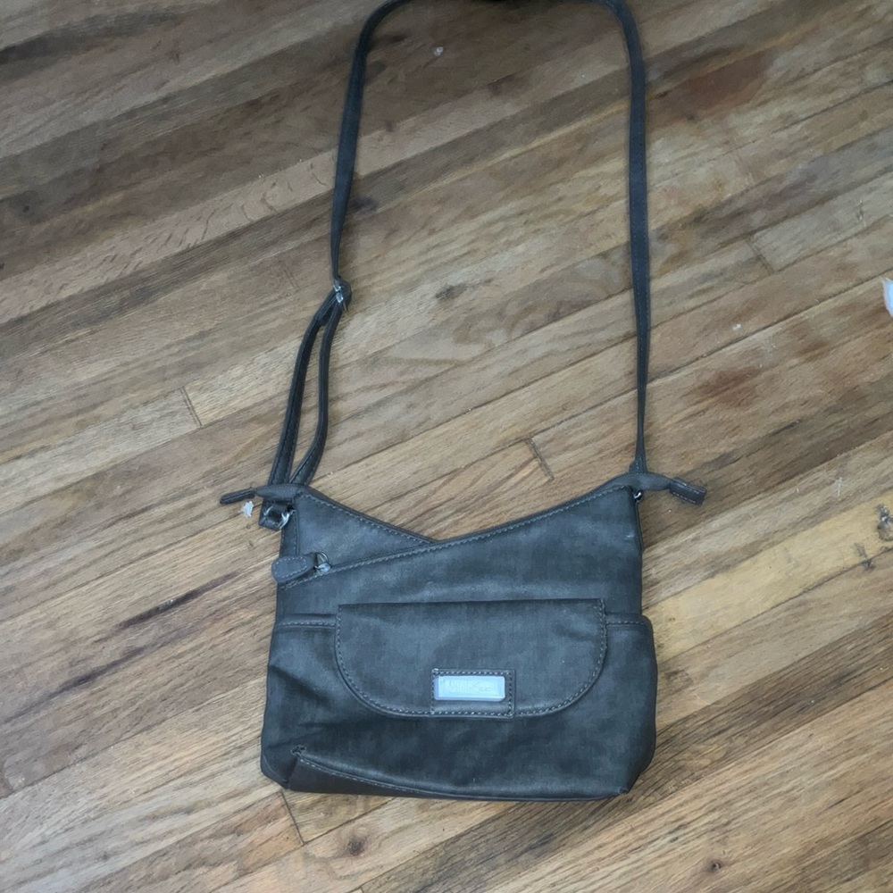 Purse grayish blue never used and I’m really good shape